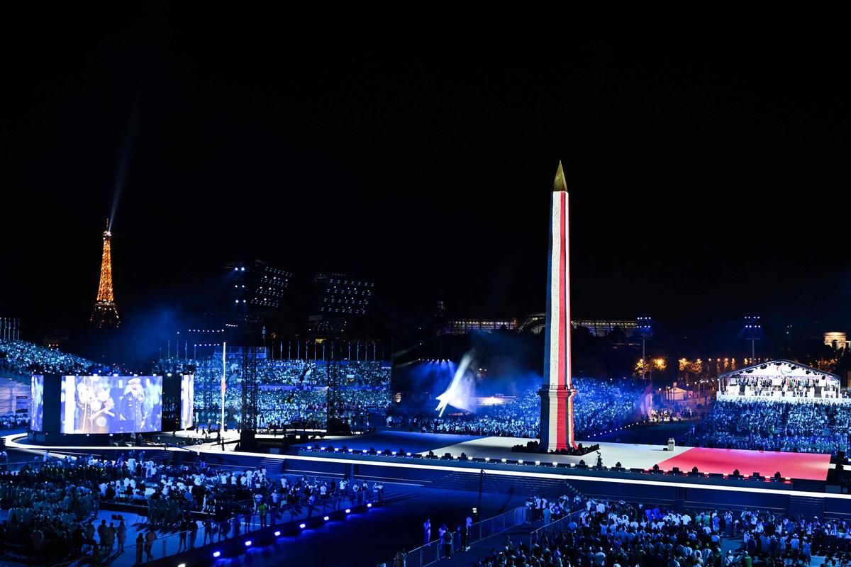 The Concorde Obelisk projection-mapped in the blue, white and red of the French flag
